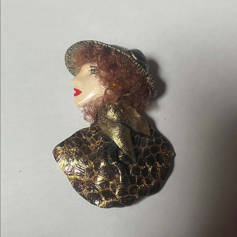 Elegant Gold and Black Brooch